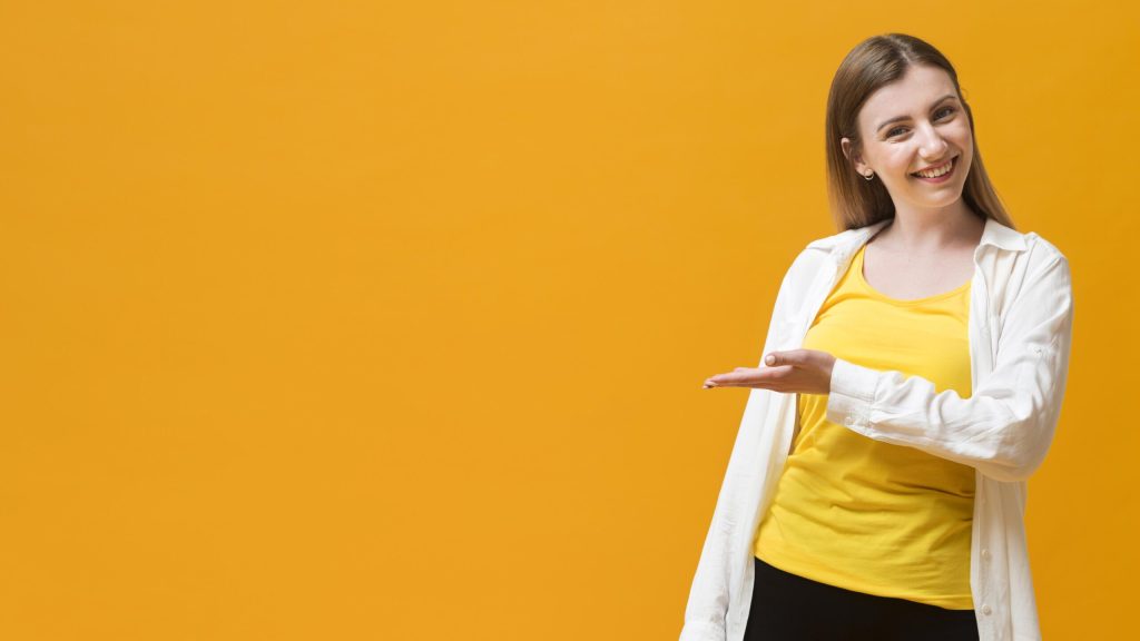 copy space woman presenting scaled.jpg